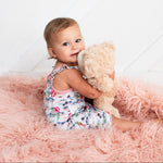 Baby bubble romper in Aloha print with flutter sleeves and snap closures along the legs