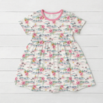 Short sleeve bamboo girls' dress in an Aloha print, shown flat with a full twirl skirt