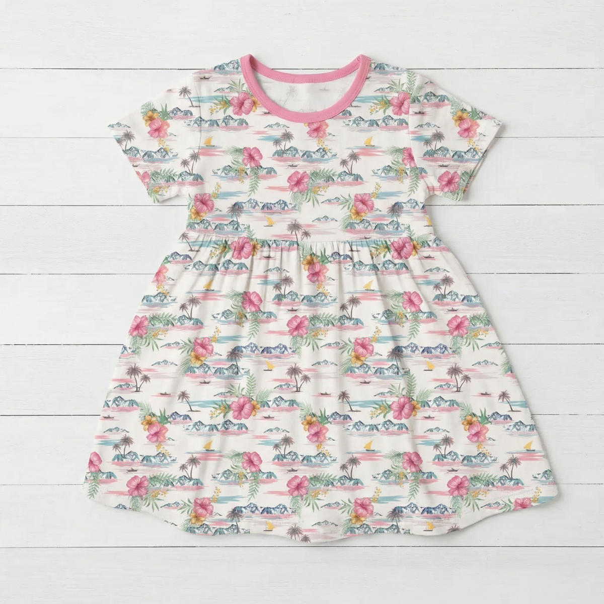 Short sleeve bamboo girls' dress in an Aloha print, shown flat with a full twirl skirt