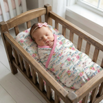 Aloha print baby swaddle blanket in a bamboo blend, spread flat to show the oversized 45 by 45 inch square