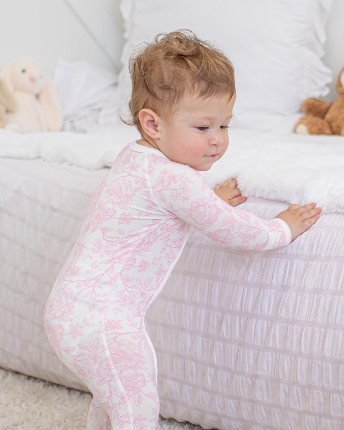 Baby footie pajamas with two-way zipper and covered feet in the Amelia print