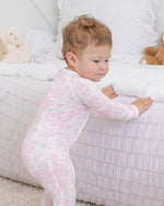 Baby footie pajamas with two-way zipper and covered feet in the Amelia print