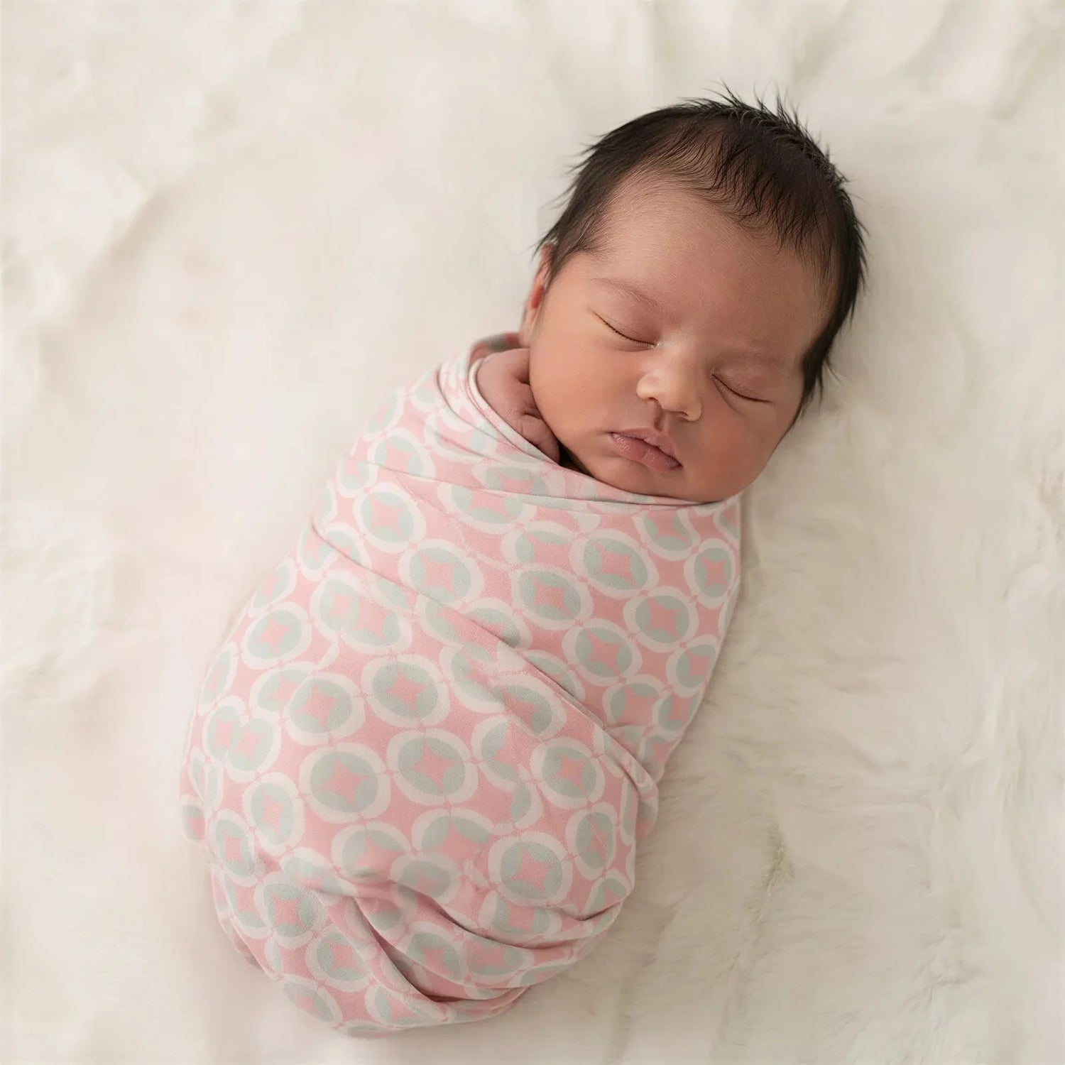 Bamboo baby swaddle blanket in a yellow lemonade and cloud print, spread flat