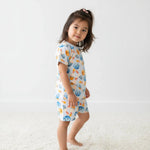 Two-piece short sleeve baby pajama set with bowling print, short sleeves and matching shorts