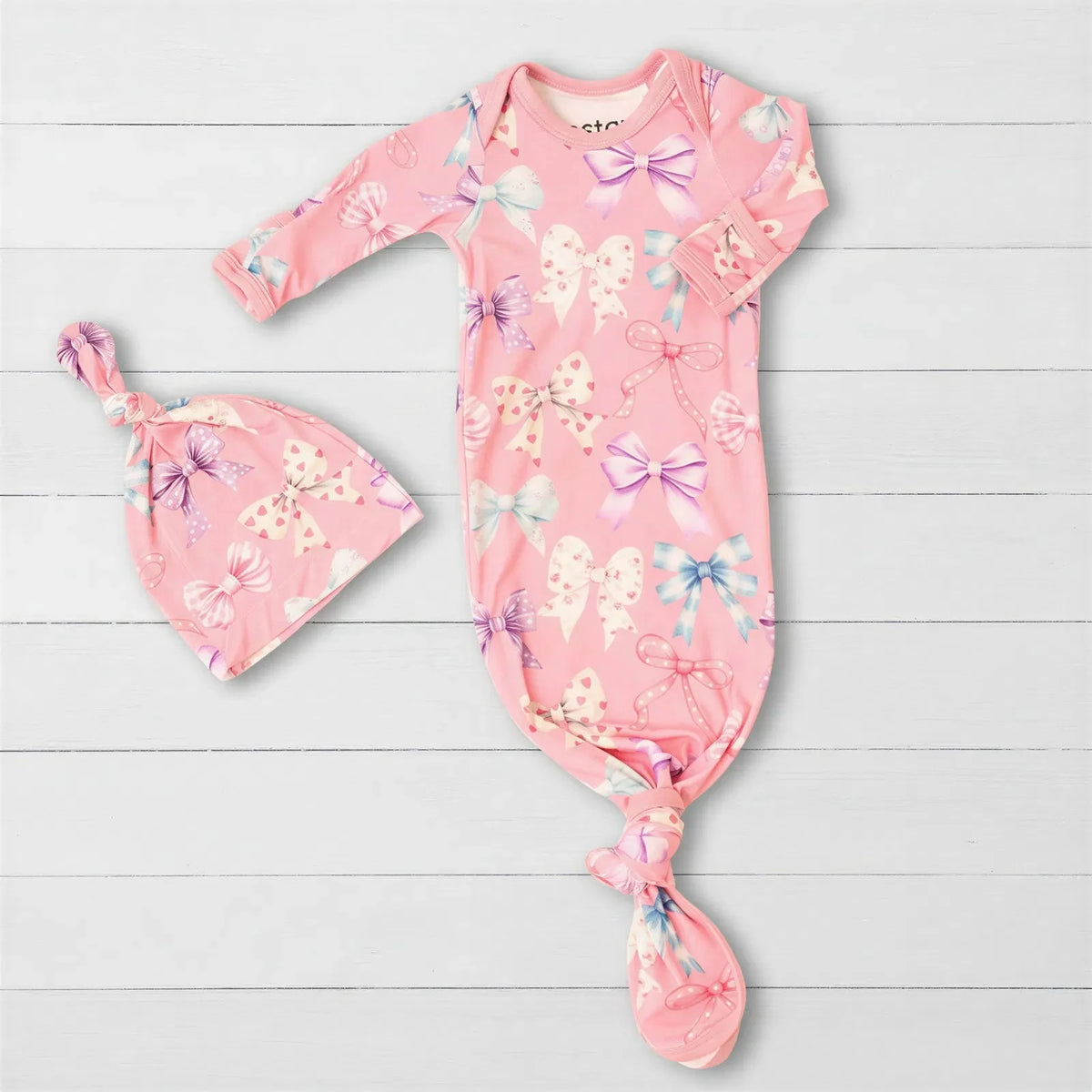 Baby knot gown and matching hat in a twinkle-tie print with fold-over mittens on the sleeves