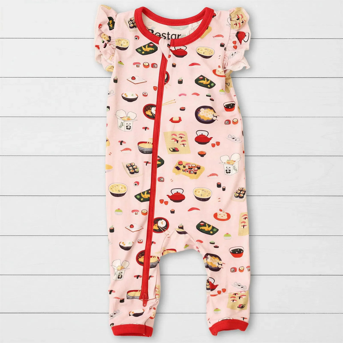 Pink flutter-sleeve baby romper with a sushi-themed print and dual zippers down the front and leg.