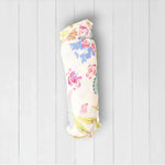 Pink flutter-print baby swaddle blanket laid out flat in a square shape