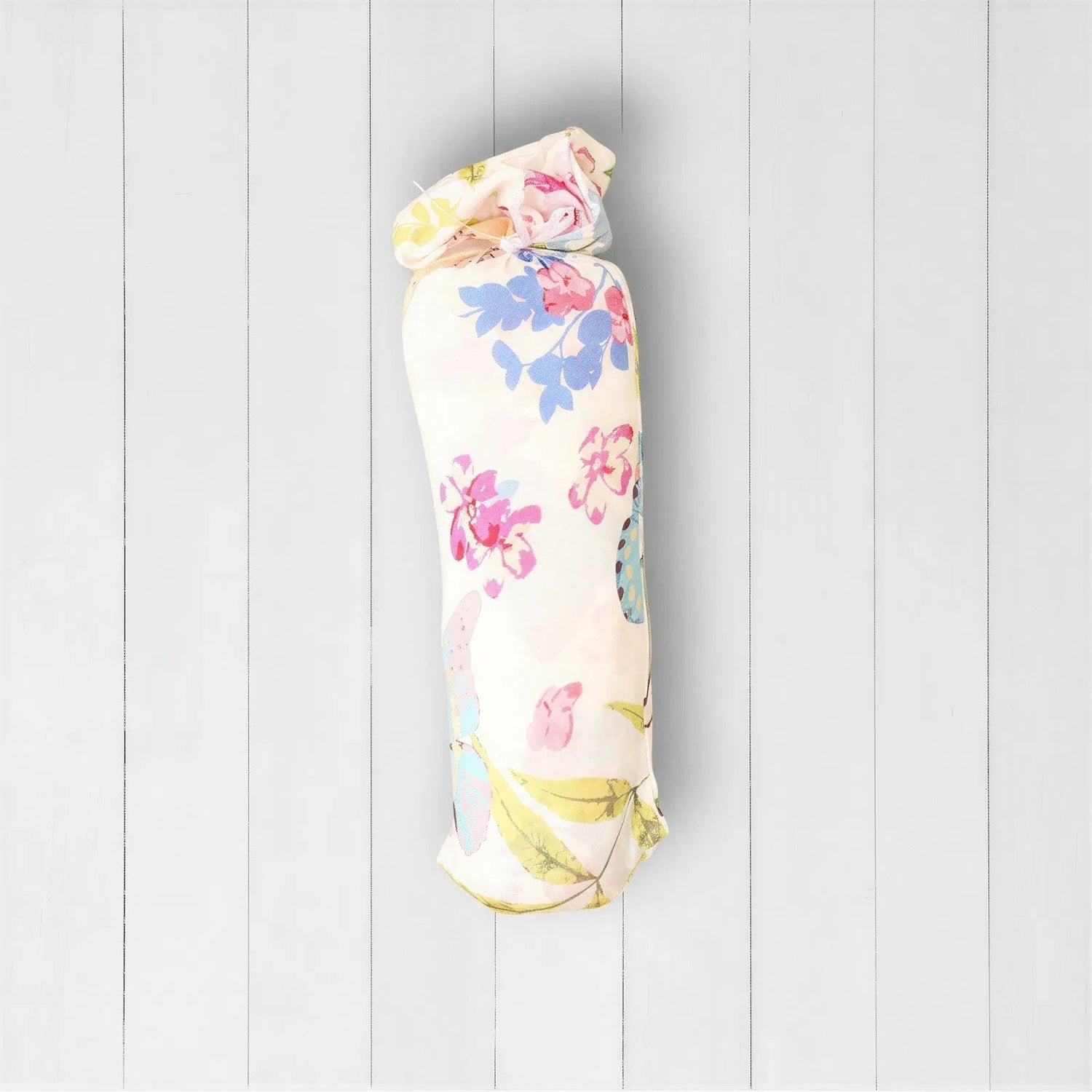Pink flutter-print baby swaddle blanket laid out flat in a square shape