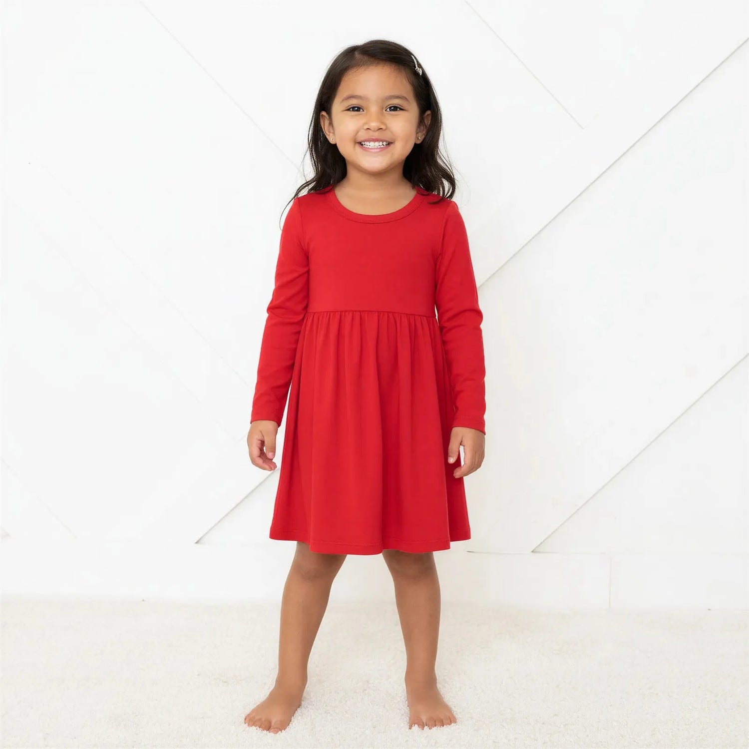 Ruby long sleeve toddler dress in a solid ruby red color with a full twirl skirt