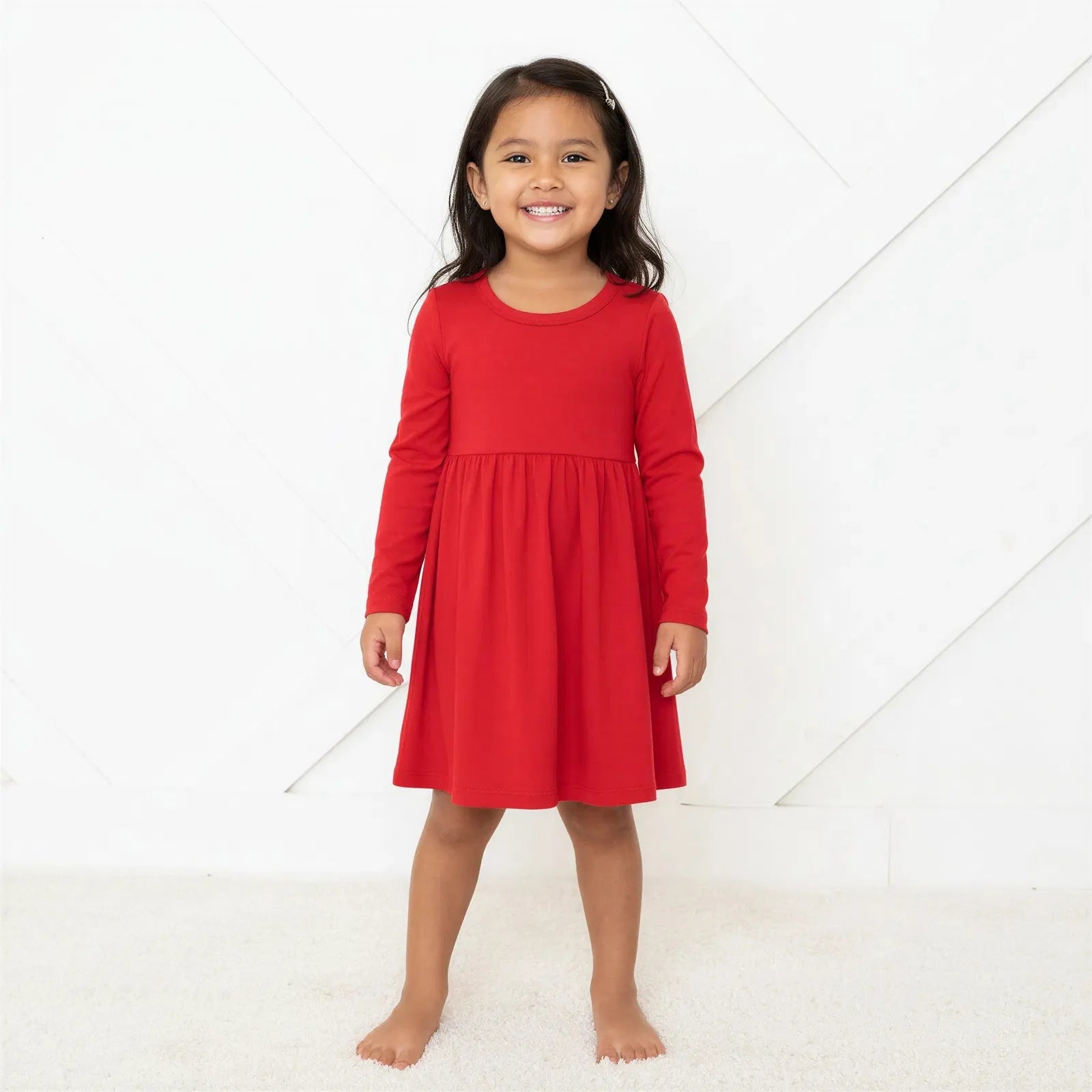 Ruby long sleeve toddler dress in a solid ruby red color with a full twirl skirt