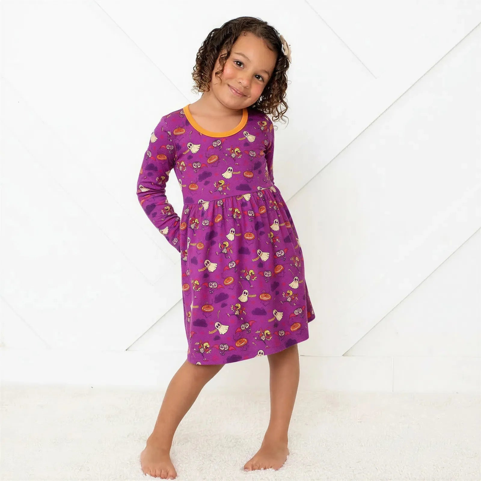 Purple long-sleeve toddler dress with a full twirl skirt
