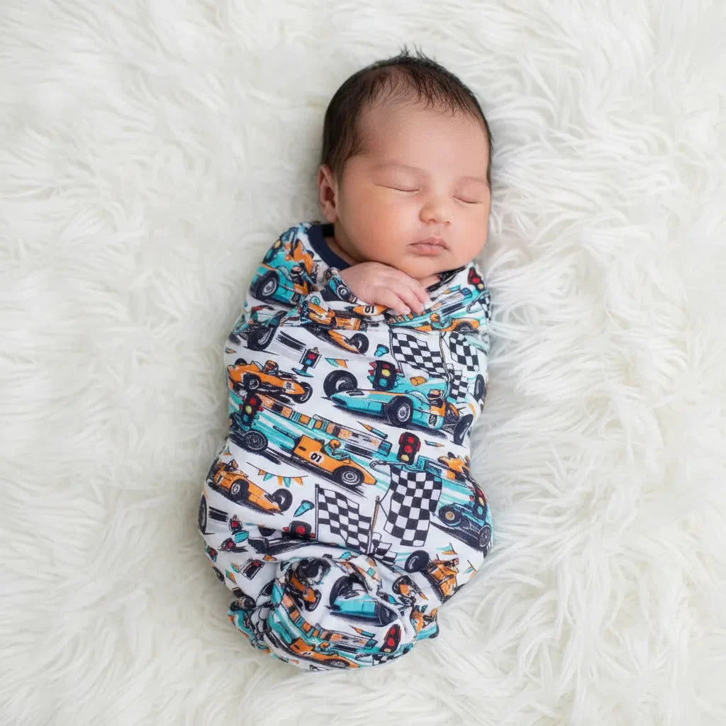 Apex Dreams swaddle blanket with superhero-inspired print spread flat to show the square shape.
