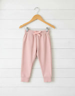 Blush pink relaxed-fit baby joggers with an elastic drawstring waist.