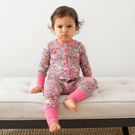 Convertible baby coverall in a pink Savanna Rose print with long sleeves, full-length zipper, and convertible feet.