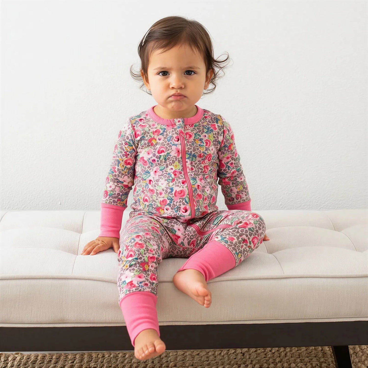 Convertible baby coverall in a pink Savanna Rose print with long sleeves, full-length zipper, and convertible feet.