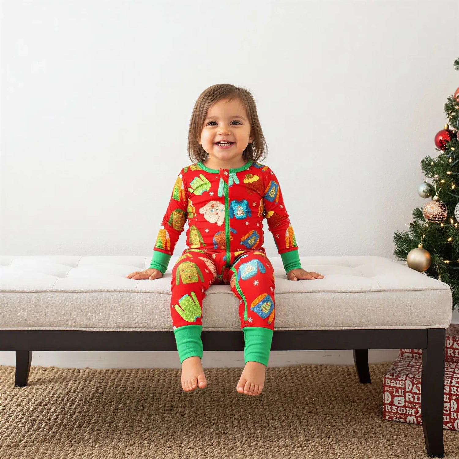 Convertible baby coverall with an ugly sweater holiday print, footed style with a full-length front zipper