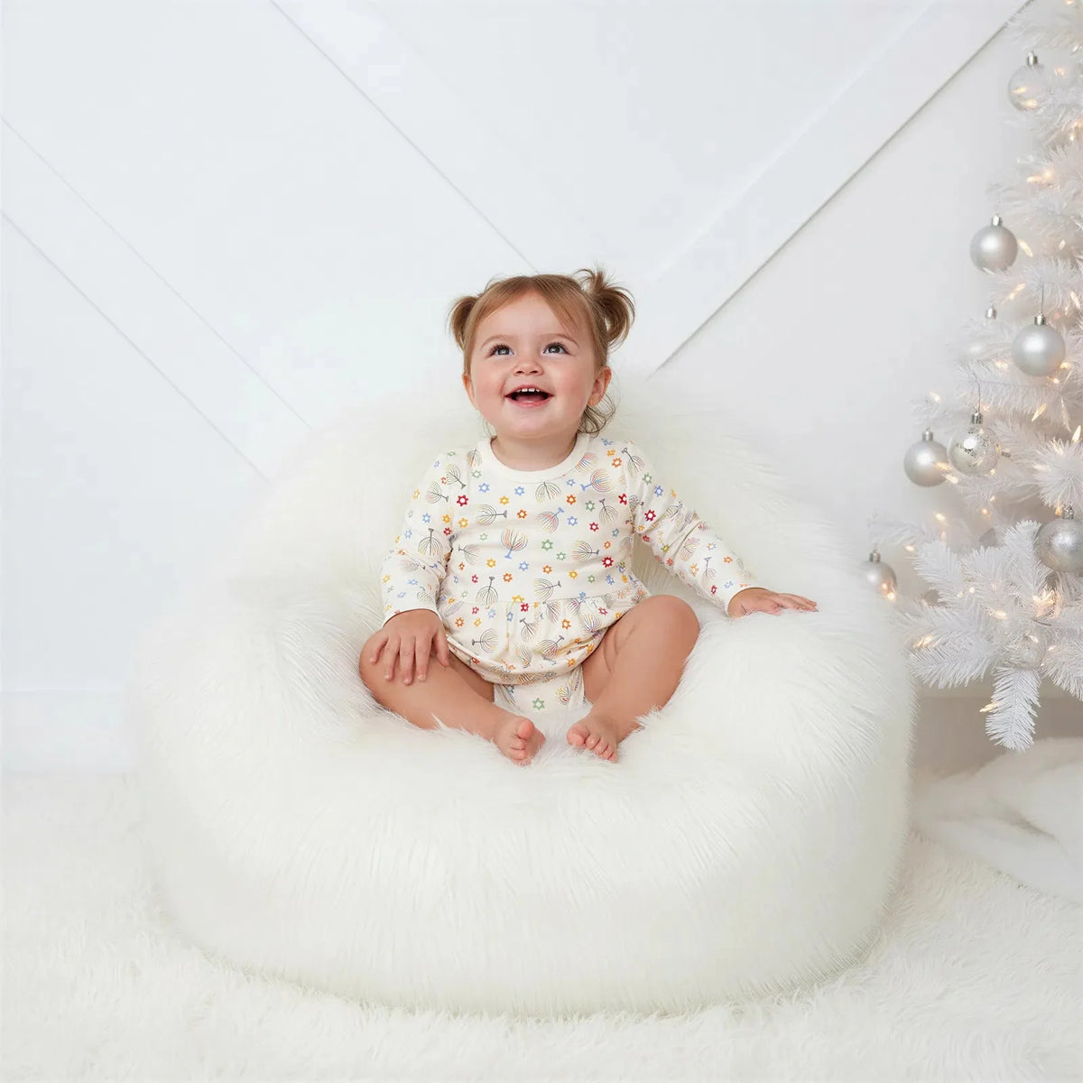 Long-sleeve baby bodysuit dress with a Hanukkah star print and snap closure at the inseam