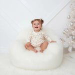 Long-sleeve baby bodysuit dress with a Hanukkah star print and snap closure at the inseam