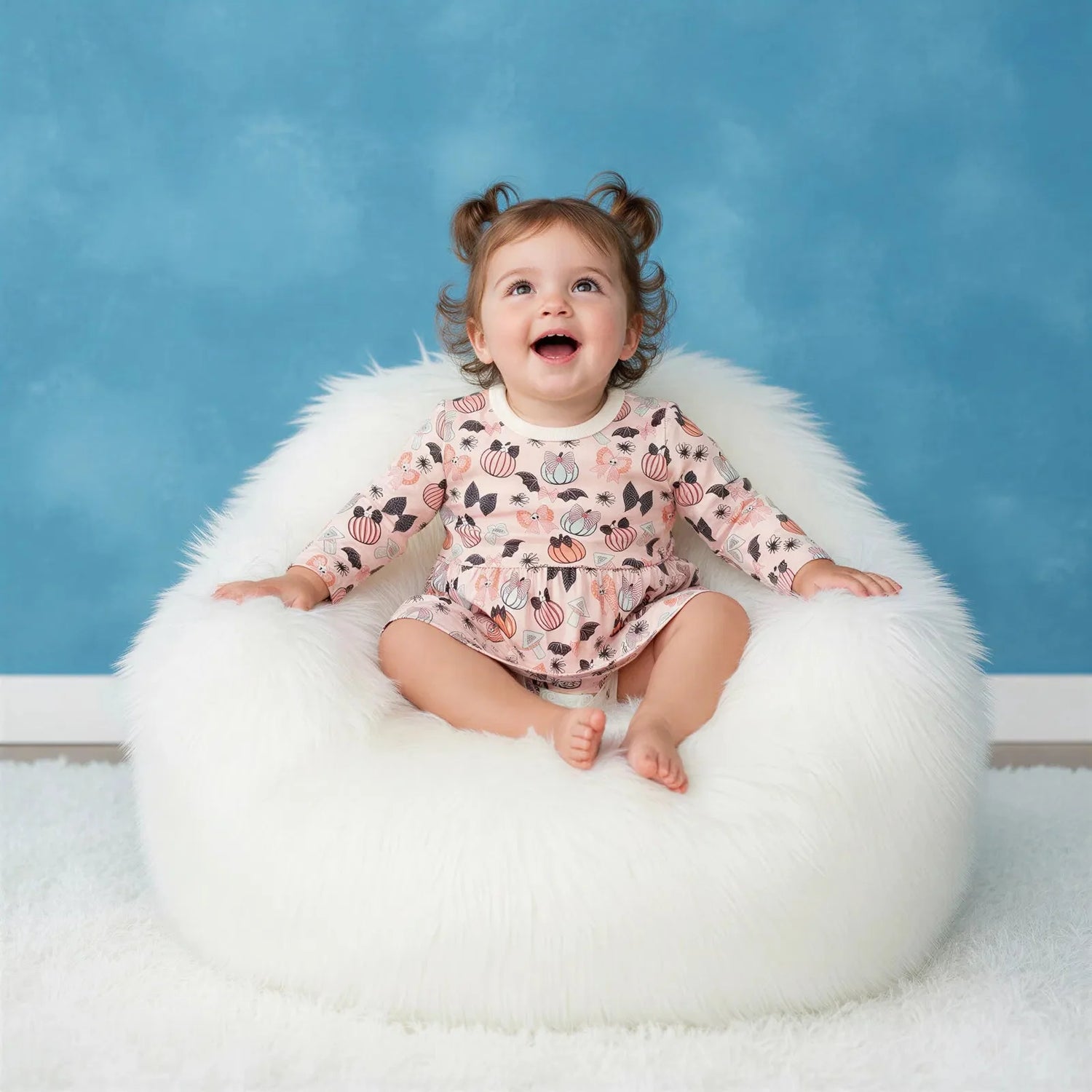 Bow & Boo long-sleeve bodysuit dress with a bow print and snap closure at the inseam