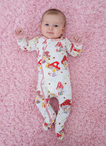 Baby footie pajamas in a Flora Shrooms mushroom print with full-length zipper and fold-over mittens