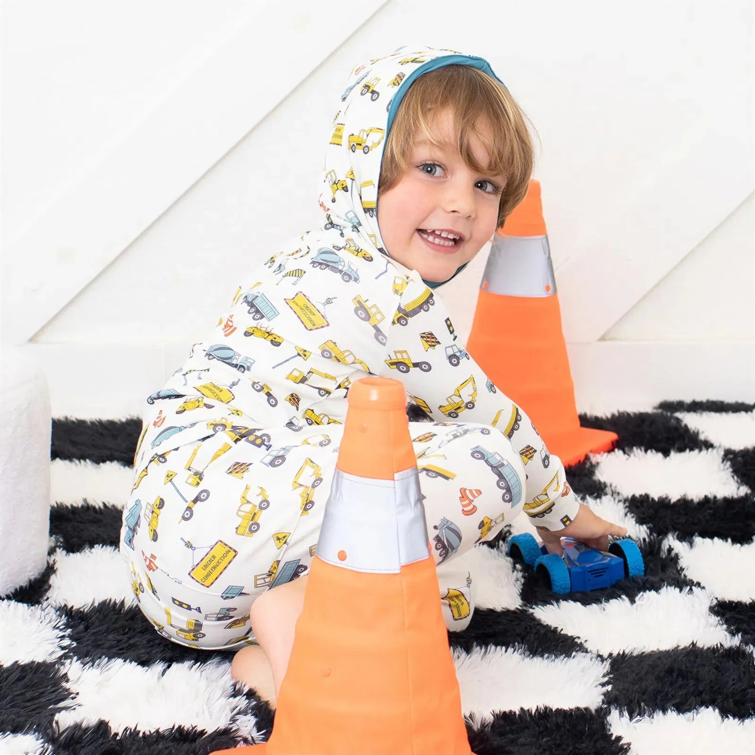 Baby relaxed fit joggers with a construction-themed busy builder print and drawstring elastic waist