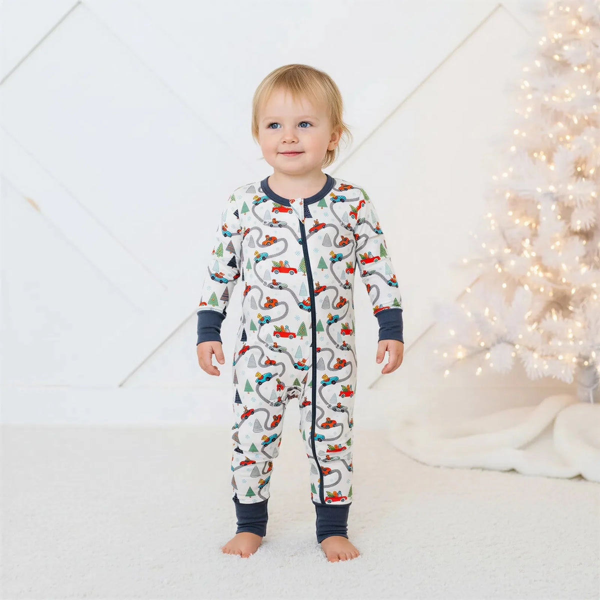 Convertible baby coverall in a festive Holiday Haul print with a full-length front zipper and footed legs