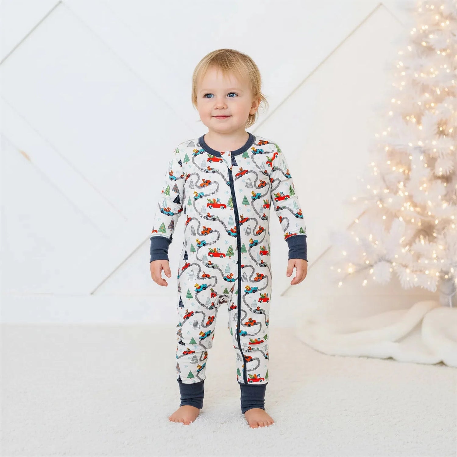 Convertible baby coverall in a festive Holiday Haul print with a full-length front zipper and footed legs