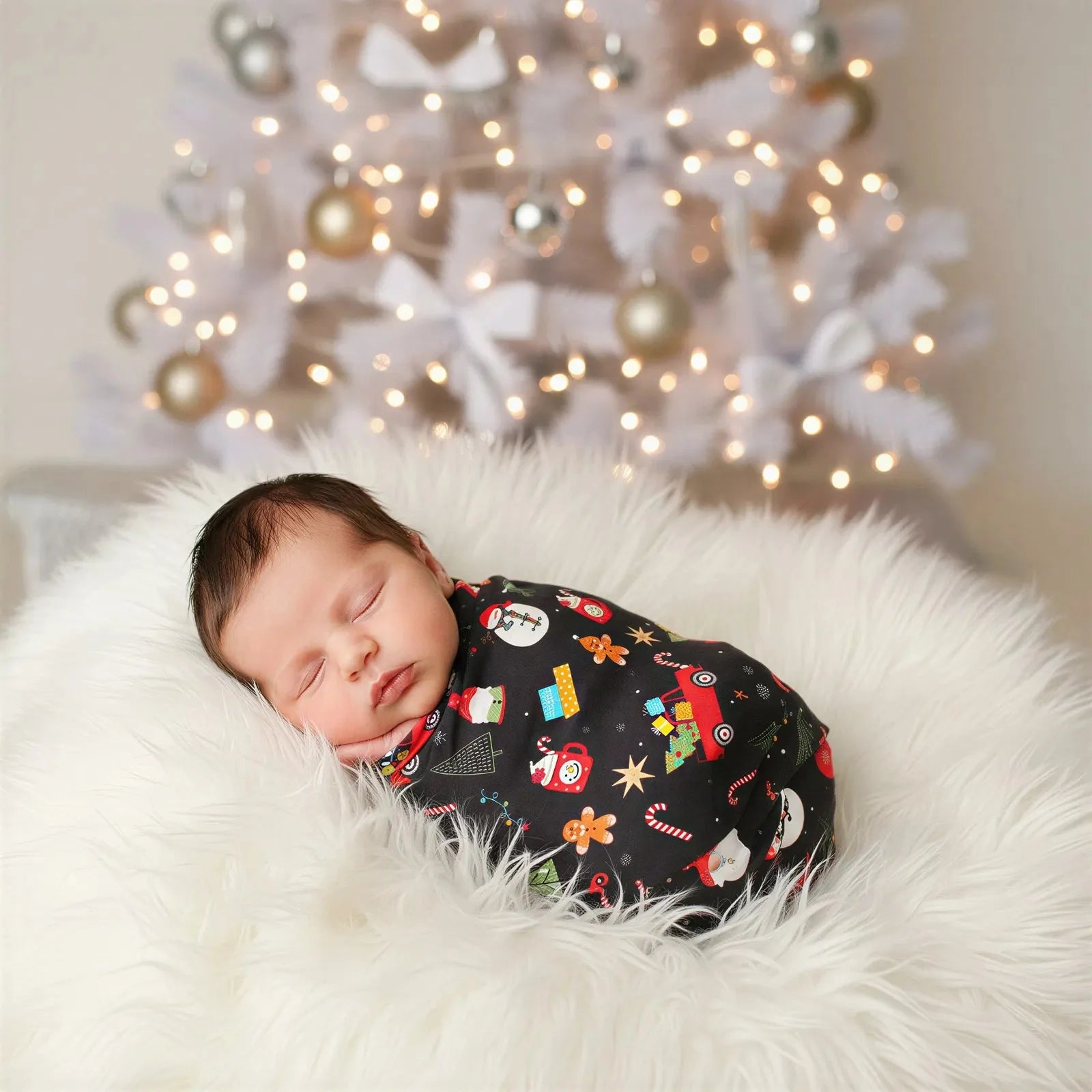Holiday Cheer swaddle blanket with a festive holiday print, spread out square