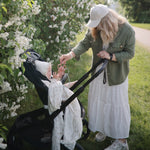 Mushie organic cotton muslin baby swaddle blanket, soft & breathable.
