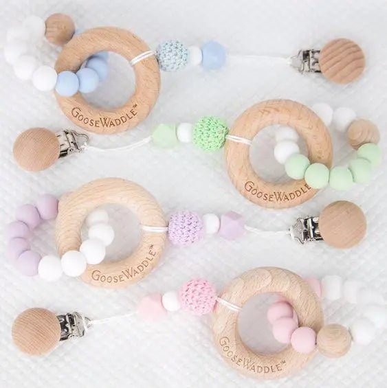 Attachable Wooden and Silicone Teether with Clasp in Four Colors.