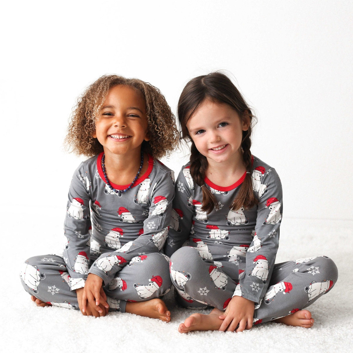 Two-piece baby pajama set with a bear print, long-sleeve top and matching pants