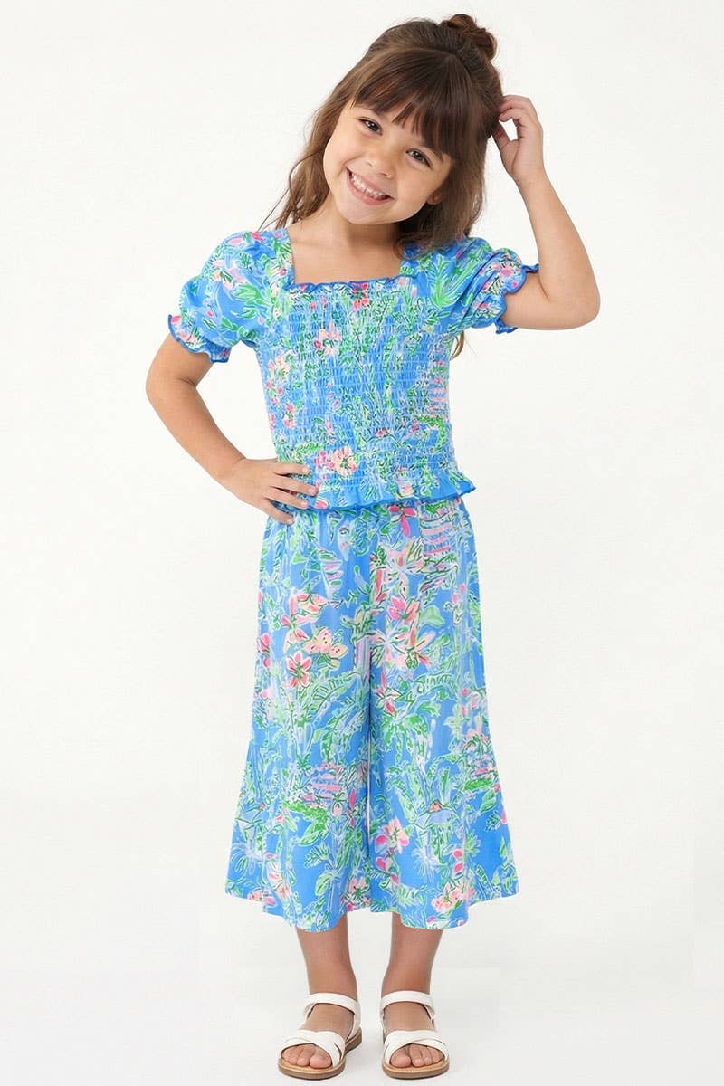 Toddler two-piece set with puff-sleeve smocked top and flared gaucho pants.