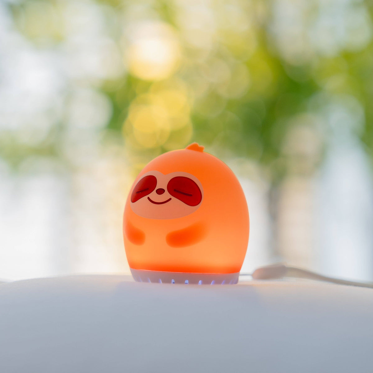 Sleeping Pal portable sloth-shaped night light and sound machine for toddlers.
