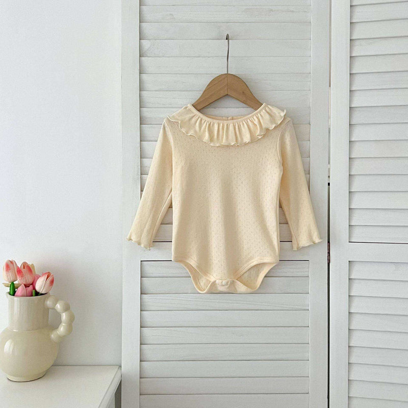 Baby GirlsThis baby girl's long-sleeved bodysuit features a charming scalloped neckline and is available in a variety of colors and sizes. Its adorable hollow-out pattern addsEveretts Place: Online Boutique 