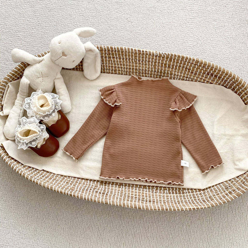 Girls Long SleevesDesigned with both comfort and style in mind, this knitted top is perfect for baby girls. The classic dots pattern adds a timeless touch to any outfit, while the lonEveretts Place: Online Boutique 