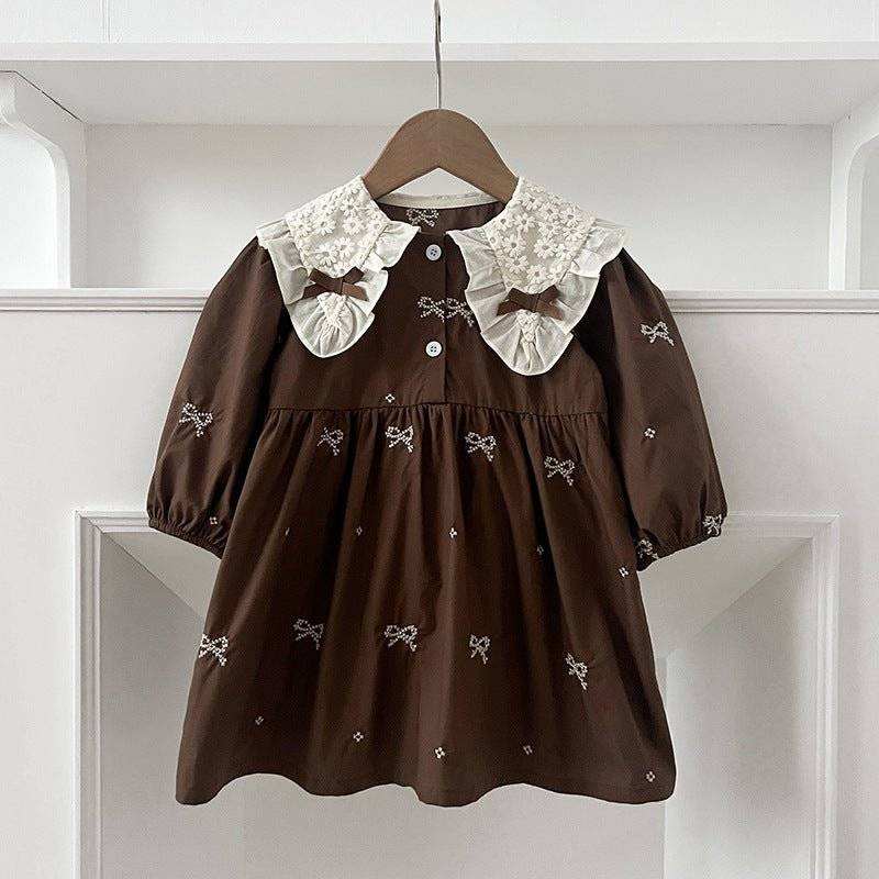 Girls long sleeves top with bows embroidery pattern and brown color.