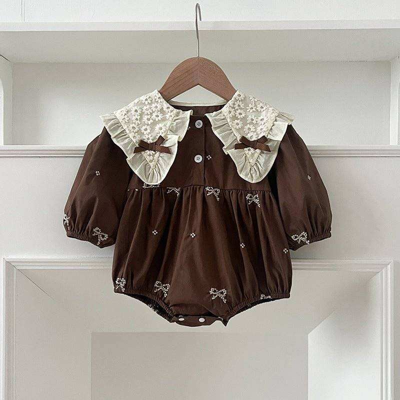 Girls long sleeve shirt with bows and embroidery pattern.