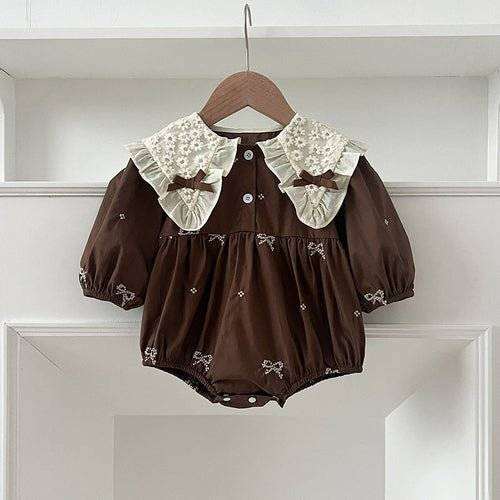 Girls long sleeves shirt with bows and embroidery pattern.