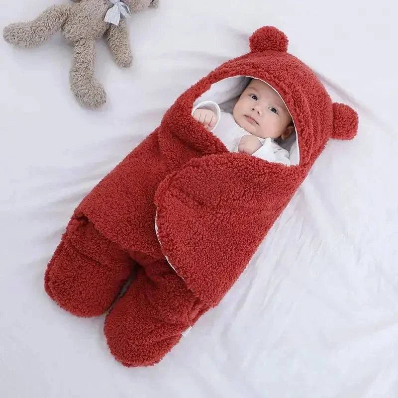 Baby sleeping bag with plush Berber fleece exterior and adjustable shoulder straps.