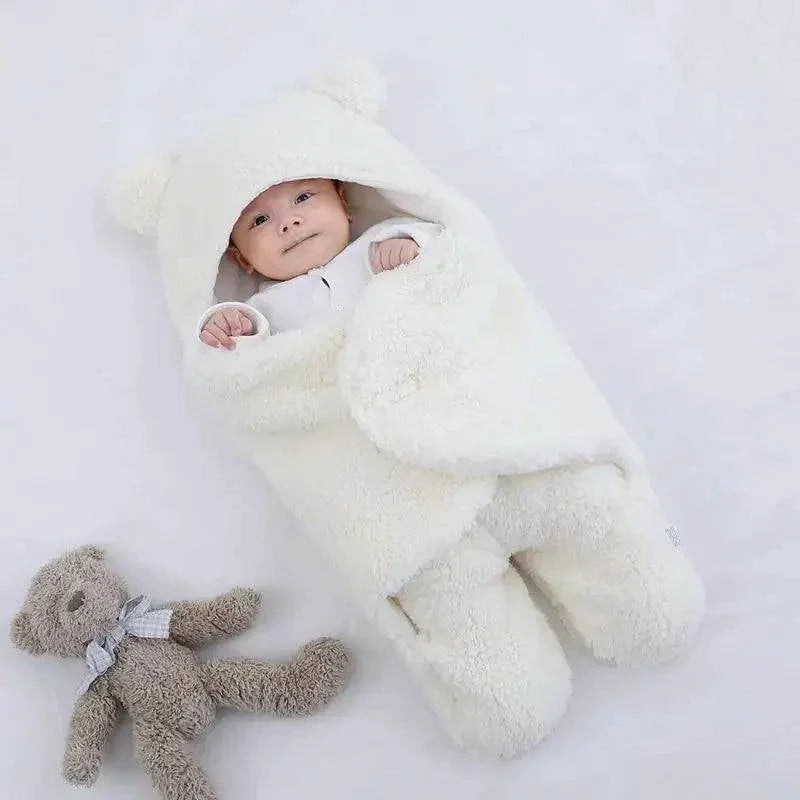 Baby sleeping bag with Berber fleece exterior and cotton lining, designed for warmth and comfort.