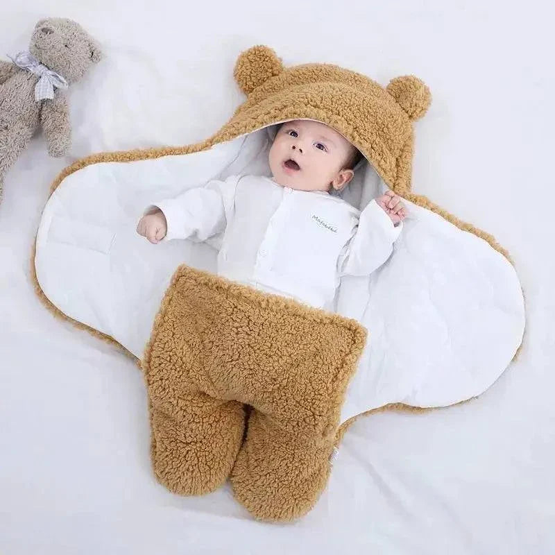 Baby in cozy Berber fleece and cotton baby sleeping bag with adjustable straps.