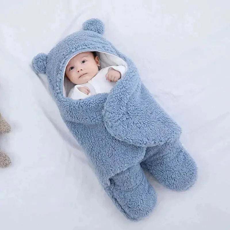 Baby sleeping bag with plush Berber fleece exterior and cotton lining, featuring adjustable shoulder straps for warmth and security.