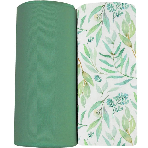 Two swaddle blankets in basil and sage green herb-garden tones, folded together.