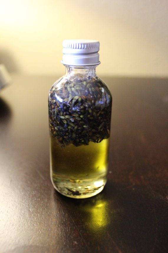 Bath Oil with Relaxing Lavender in a 2oz bottle featuring organic lavender buds and healing oils.