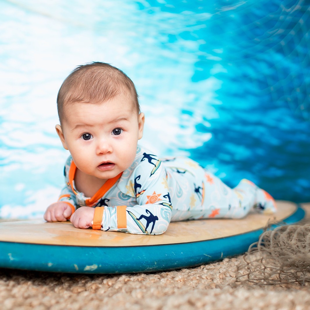 Baby footie pajamas in Beach Break print with full-length two-way zipper and covered feet