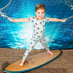 Two-piece Beach Break pajama set with short sleeve top and matching long pants in a beach print