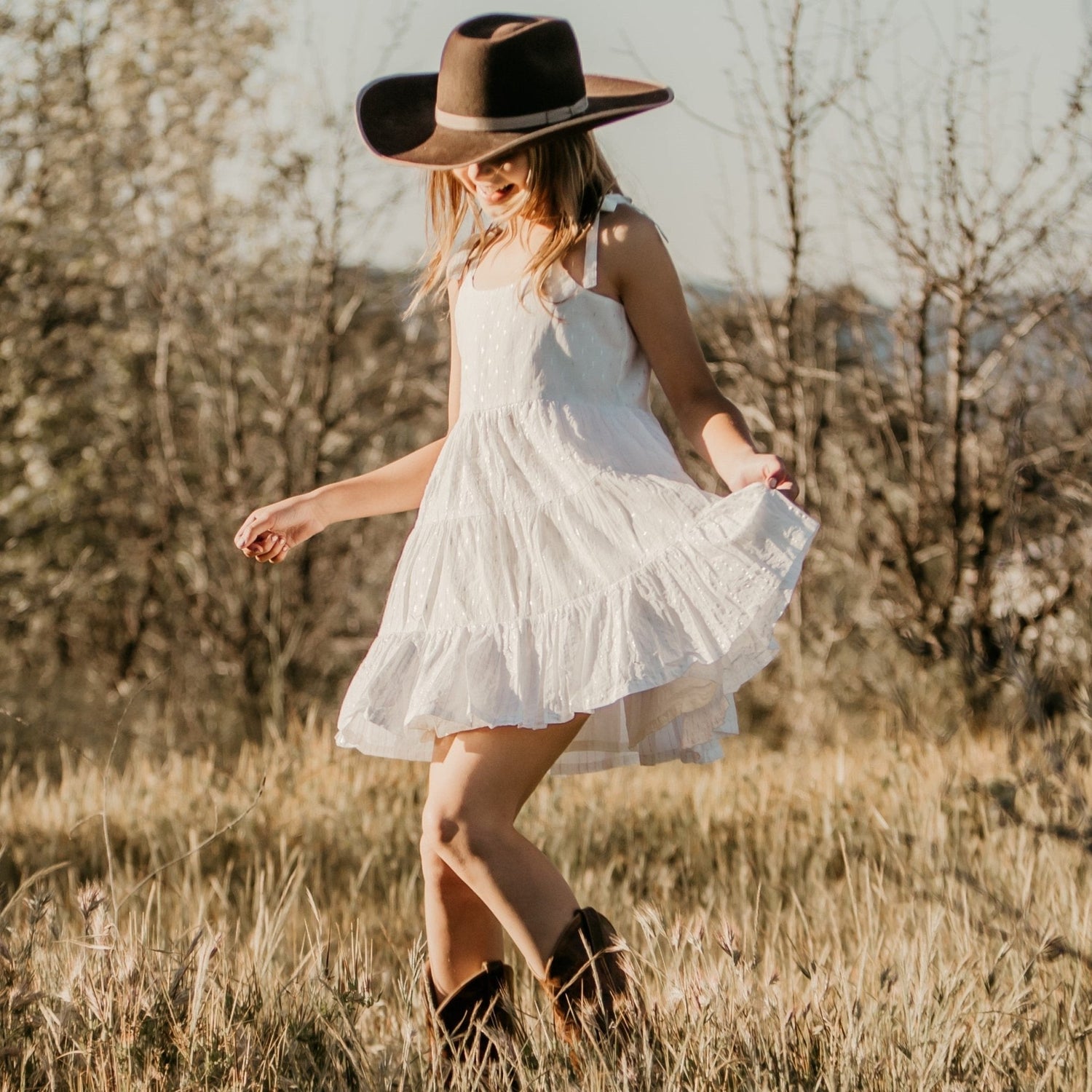 White sparkle dress with flowy tie straps for a baby