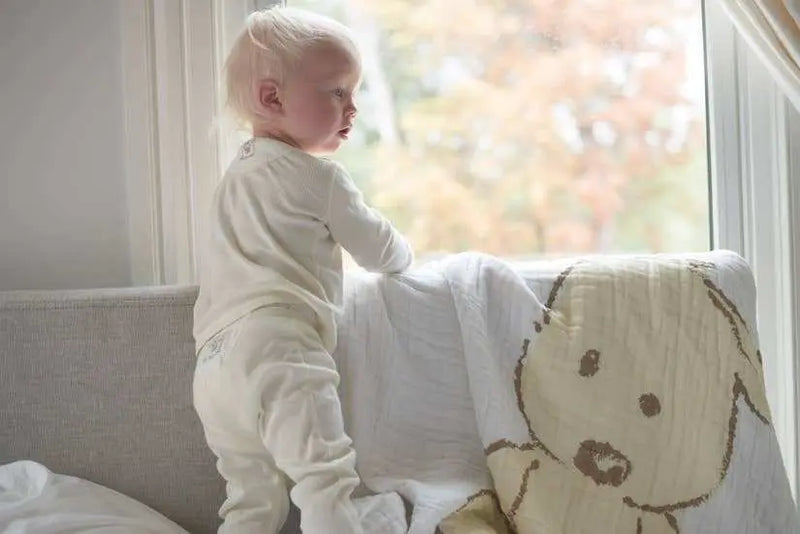 Newcastle Classics - child with teddy bear print muslin blanket.