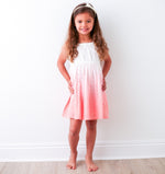 Baby girl's eyelet dress in ombre white to pink with an elastic neckline.