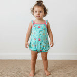 Baby bubble romper in a Bloom Bugs print with flutter sleeves and snap closures along the legs